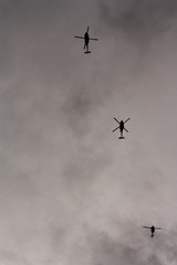  Helicopter flying over a gray sky
