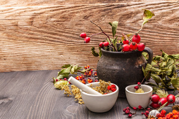 Halloween concept background. Witch bowler, mistletoe, elderberry. Dry herbs, flowers, fresh berries