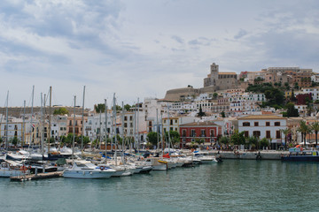 Fototapeta na wymiar Old town of Ibiza, seen from the water in the harbour, Ibiza