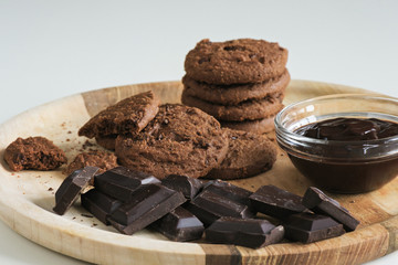 Brown biscuits with dark chocolate composition