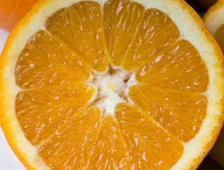 Fototapeta na wymiar Sliced orange fruit to squeeze