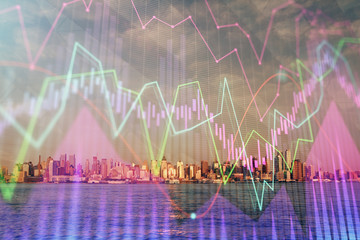 Forex chart on cityscape with skyscrapers wallpaper double exposure. Financial research concept.