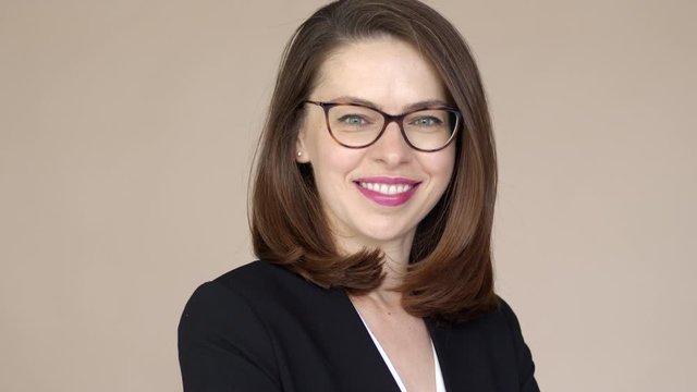 Portrait of a businesswoman with glasses smiling and happy