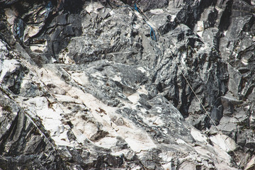 Fototapeta na wymiar Climbing ropes on a gray rock