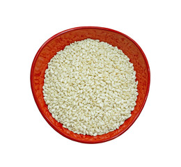 White sesame seeds in red cup isolated on white background.Herb.cereal.Top view and close up.