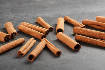 Cinnamon sticks on the gray stone texture with copy space	