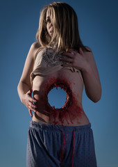FX Through Body Gunshot Wound, Girl with hole through her - obrazy, fototapety, plakaty