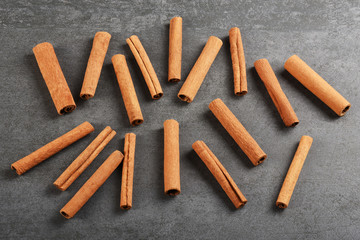 Cinnamon sticks on the gray stone texture with copy space	