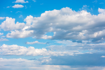 Beautiful and thick clouds in the blue sky. Cloudy sky on a clear day