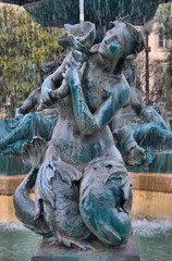 Fototapeta na wymiar Baroque Fountain in Dom Pedro IV square in Lisbon, Portugal