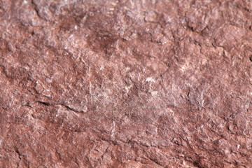 Grainy red stone texture. Natural backgrounds and textures. Horizontal.