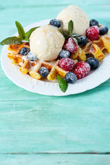 belgian waffles with ice cream and berries