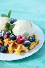 belgian waffles with ice cream and berries