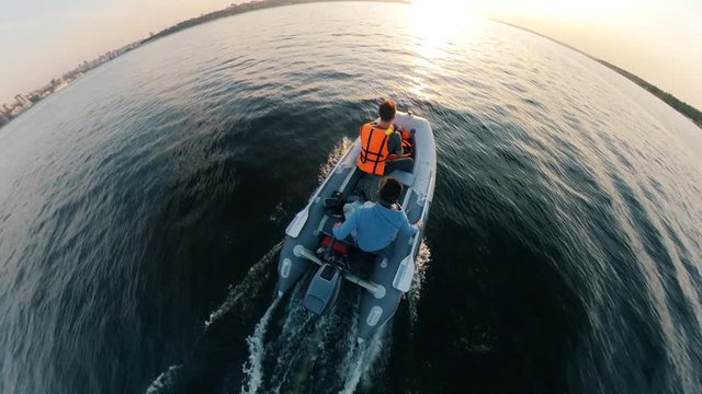 Top view of a rubber boat carrying two men