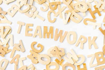 Teamwork Wood Text on the white Table Office.