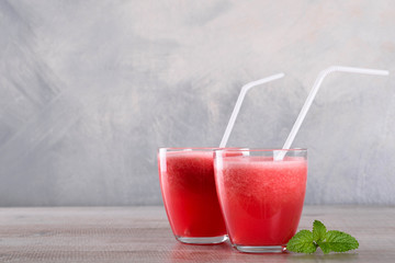 Watermelon smoothie on wood background , healthy drink. Summer. Watermelon pieces. 