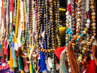Fototapeta premium Rishikesh, India. Indian traditional handicraft (glassbeads) on the street market.