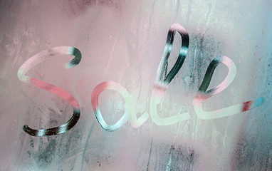 inscription sale on a foggy window, creative management
