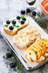 Toasts with berries and fruits. Healthy breakfast concept. Simple and tasty food.