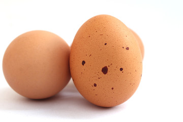 The skin of the egg has strange black spots. on the White Blackground