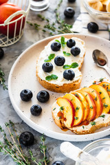 Toasts with berries and fruits. Healthy breakfast concept. Simple and tasty food.