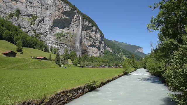 Landscape in the Lauterbrunnen Valley with the river Weisse Luetschine and the Staubbach Falls in Lauterbrunnen