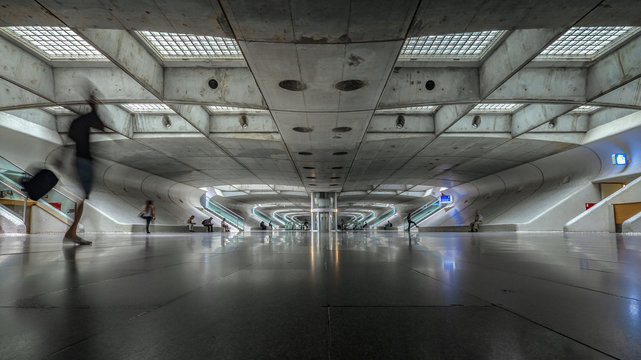 Lisbon train station, Portugal; the Gare do Oriente designed by architect Santiago Calatrava. An abstract business man walking to his platform.