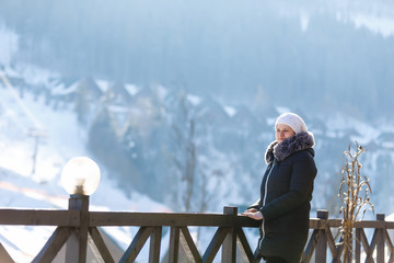 woman walks in the mountains in winter