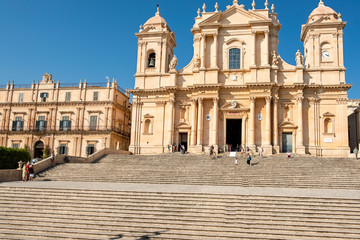 Fototapeta na wymiar View of the San Nicolò church facade, in the city of Noto (Southern Italy, island of Sicily). Built in the typical Sicilian baroque style, it is an UNESCO World Heritage site, is also famous for its s