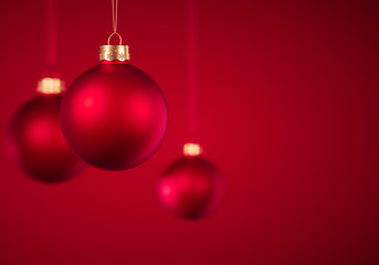 Three Christmas baubles hanging on red background, for modern design winter holiday card background...