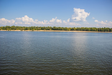 Tour of Kiev in the center of Europe. View of the Dnieper, Trukhanov island and a foot bridge. Park fountain and sunset on the horizon..