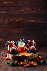 Fototapeta na wymiar Christmas tea - grape and lemon tea with chocolate cake