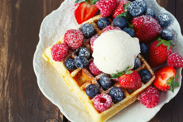 belgian waffles with ice cream and berries