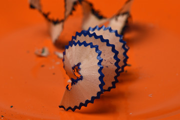 pencil shavings on  orange background close-up