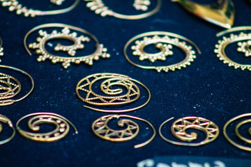 Closeup of jewelry sold in a shop in the streets of Rome
