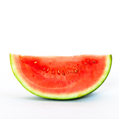 Studio shot single slice cut of mini organic watermelon isolate on white