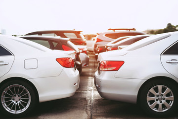 aerial car Parking lot full outdoors Square, cars in row Parking on the side of the jam and evening sun. Leave space empty for text. © methaphum