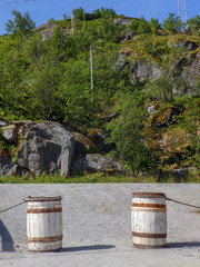 picture with two white barrels on the road