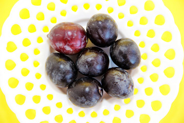 black natural fresh olives on a white decorative plate