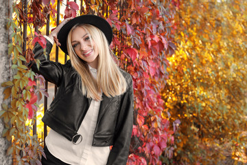 Beautiful young woman in autumn park
