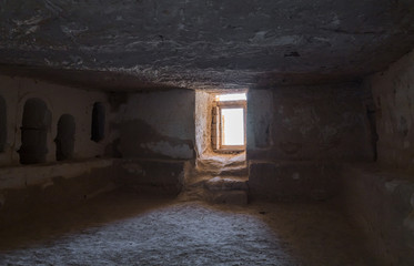 The interior  with empty graves of the Roman burial chamber on the ruins of the Nabataean city of Avdat, located on the incense road in the Judean desert in Israel. 