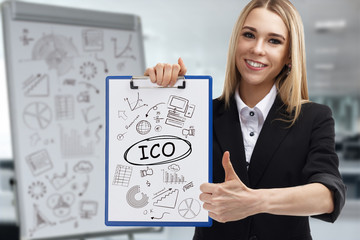 Business, technology, internet and network concept. Young businessman shows a key phrase: ICO