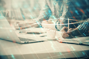 Multi exposure of forex chart with man working on computer on background. Concept of market analysis.