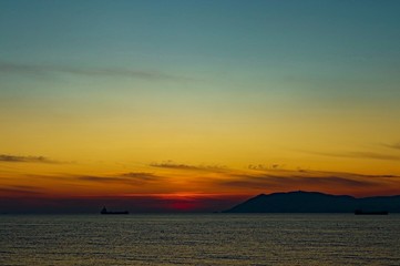 Naklejka premium sunset at sea in view of the ship