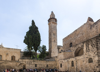 Fototapeta premium View of the Omar Mosque from the courtyard of the Church of the Holy Sepulchre in the Old City in Jerusalem, Israel