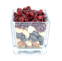 Bowl with different dried fruits and nuts on white background