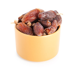 Bowl with dried dates on white background