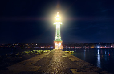 Paquis lighthouse in Geneva at night