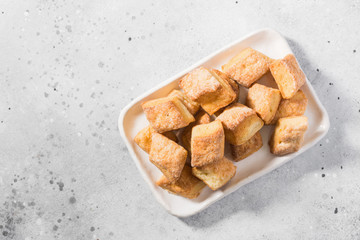 Cottage cheese cookies on a rectangular ceramic plate on a light gray background. Top view	