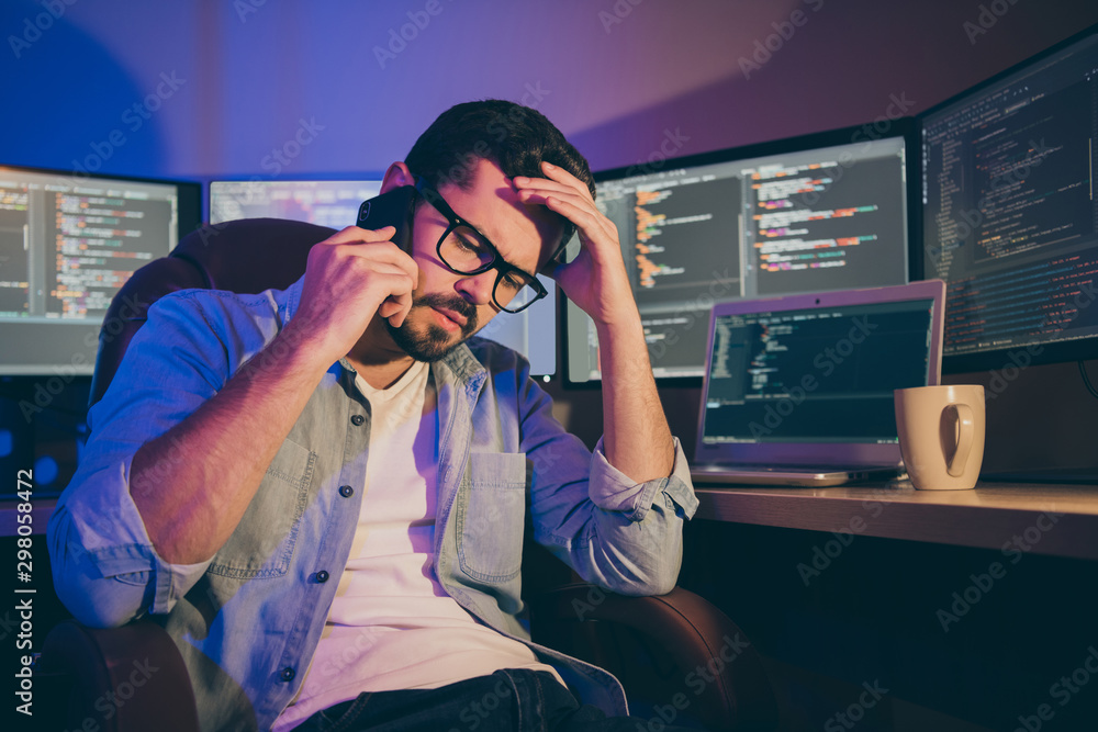 Poster portrait of his he nice attractive worried guy tech expert geek nerd talking on phone discussing new
